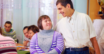 caregiver supporting an special woman